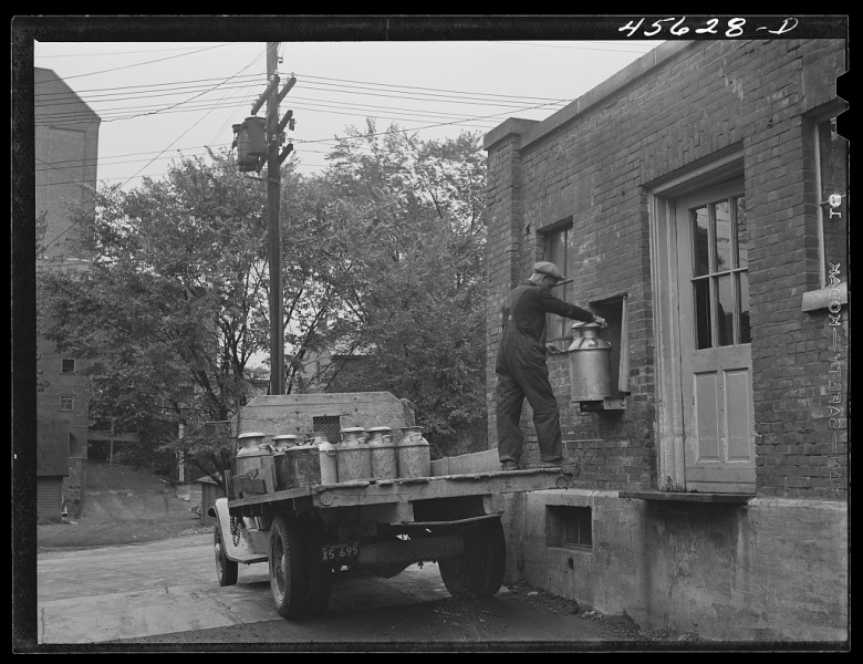 1941-Farmer-getting-his-empty-milk-cans-back-at-the-Burlington-cooperative-milk-bottling-plant.-Burlington-Vermont